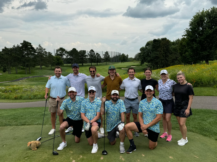 Yardstik team golfing together